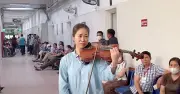 Nghệ sĩ Nguyệt Thu chơi viola ở hành lang bệnh viện, lời cầu nguyện sau ca cấp cứu