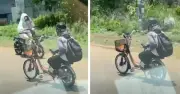 Clip thiếu niên buông hai tay khi đi xe đạp điện gây lo ngại