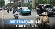Người dân Hà Nội mặc áo khoác giữa mùa hè oi bức