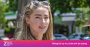 Amber Heard tuổi 40 rạng rỡ đạp xe cùng con gái ở Madrid