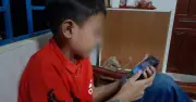 Con 'nghiện' điện thoại hay người lớn không nêu gương?